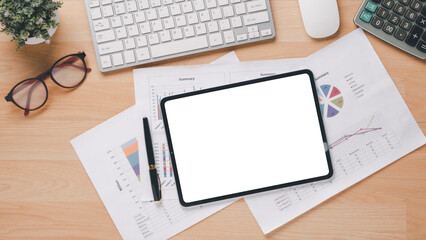 Wall Mural - Top view of a professional workspace featuring a tablet with a blank screen, laptop, financial reports, calculator, and a cup of coffee.