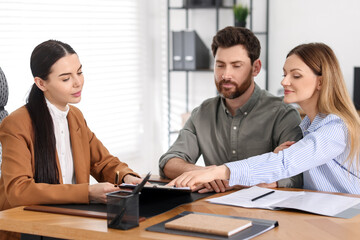 Wall Mural - Couple having meeting with lawyer in office