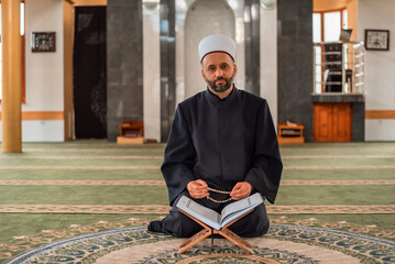 Wall Mural - A Muslim man prayer praying inside the mosque.