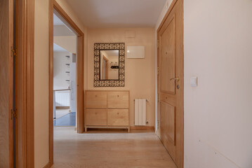 Wall Mural - Entrance hall to home with armored oak wood door, beech shoe rack and mirror with metal wrought iron frame