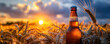 Bottle with beer against wheat field on sunset. Field of barley on summer or autumn day. Brewing. International beer day. Oktoberfest