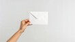 silent invitation: the subtle anticipation of a held envelope
