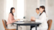 Blurred concept of group of women wearing casual wear meeting in the office. Corporate employee. Human resources.
