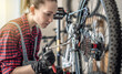 Woman is performing maintenance on mountain bike. Concept of fixing and preparing the bicycle for the new season