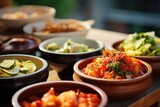 Fototapeta Natura - South Korean banchan dishes arranged on a Hanok village patio.