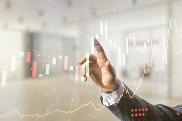 Poster - Multi exposure of businessman hand working with virtual creative financial graph and world map on blurred office background, forex and investment concept