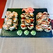 Sushi set on a black plate, close-up, selective focus
