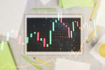 Poster - Multi exposure of abstract financial graph with world map and modern digital tablet on desktop on background, top view, financial and trading concept