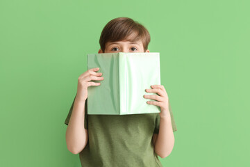 Sticker - Little boy with book on green background. Children's Day celebration