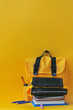 An isolated image of a school bag and educational materials against a Yellow background, embodying the essence of returning to school
