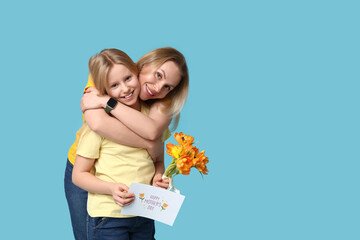 Canvas Print - Cute little girl with her mom, festive postcard and bouquet for Mother's Day hugging on blue background