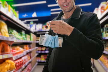 Wall Mural - Closeup photo of male customer holding money in medical mask because of more expensive food due virus epidemic. Cash payment made: Dollars exchanged at the supermarket checkout