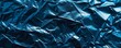 Textured blue foil with crumpled pattern