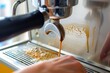 closeup of a person cleaning espresso machine