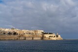 Fototapeta  - view of downtown Valletta and St. Elmo's Fire under an overcast sky
