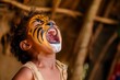a child with face paint roaring like a lion, amused