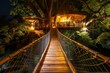 suspended wooden bridge leading to an illuminated treehouse cafe