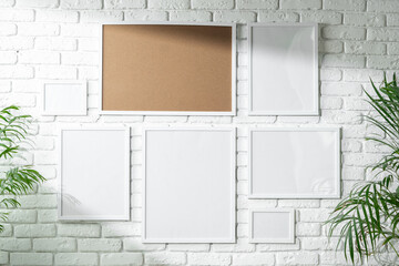 Sticker - Varied Sized Photo Frames Displayed on a White Brick Wall