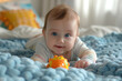 A cute blue eyes baby with toys on a bed, adorable baby, cute baby playing with toys