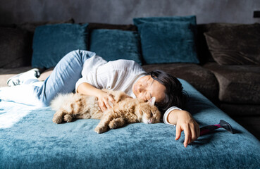 Wall Mural - Beautiful young Asian woman with cute ginger cat at home.