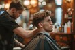 Barber giving young man stylish haircut with scissors and comb in barbershop