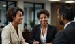 A black businesswoman t is having a cheerful conversation with customers office. 
