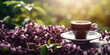 Сup of Сoffee with Lilac Flowers on a table in the Garden on a Spring Morning