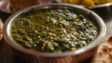 Fototapeta  - A traditional Punjabi meal featuring sarson da saag, a hearty dish made from mustard greens, spinach, a