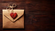 Brown envelope with red heart and string