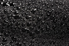 Close-up View On Water Drops On Waterproof Impregnated Fabric In Rain