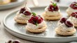 Delightful cherry-topped pastries on a modern plate, perfect for catering events. Fresh ingredients, elegant dessert presentation. Ideal for food blogs and menus. AI