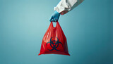 Fototapeta Most - A red biohazard refuse bag is used to safely contain and dispose of hazardous biomedical waste in clinical and healthcare settings