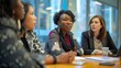 Diverse team of professional businesswomen engaging in strategic planning and discussion in a corporate office setting