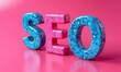 Colorful letters SEO written on rosa background. Search Engine Optimization concept