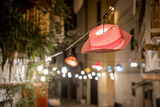 Fototapeta Tęcza - Hanging red hat-lantern on the street of the old town of Bari. Italy