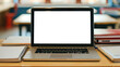 © Maxim Filitov - Laptop with blank transparent screen on the table by the notebooks and textbooks in a cozy school classroom. Mockup image