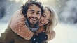 Happy young couple having fun outdoors in winterwear enjoying snowfall