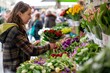 woman purchasing fresh flowers from a market stall