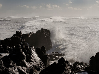 Poster - Small cape being hit by strong stormy sea waves