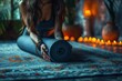 Young woman rolling a yoga mat at home close up shot