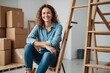 Smiling woman sitting on ladder at new home