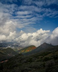 Wall Mural - Mountain with cloudy blue sky in the background