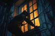 burglar breaking into a house from window