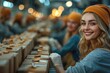 Smiling young workers packaging products in as factory