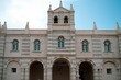 Sunlit exterior of an ornate building featuring several arched windows: Tropea, Calabria