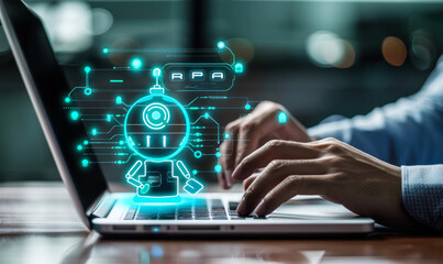 Robotic Process Automation concept represented by hand gesturing RPA hologram on touch display using laptop, technological integration & streamlining of digital operations through software automation