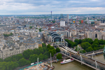 Wall Mural - Charing Cross Station, Hungerford Bridge and Golden Jubilee Bridge aerial view over River Thames in London, England, UK. 