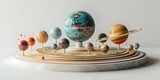 Fototapeta  - A detailed model of the solar system with different celestial bodies arranged on a cosmic carousel display against a plain white background