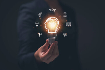 Poster - Glowing light bulb in hand, idea search concept Creativity from information trade in the internet world,education , business ideas and target groups.