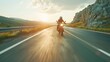 A motorcycle rider cruising along an open highway. 